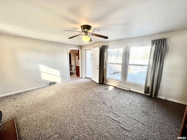 spare room featuring carpet flooring and ceiling fan