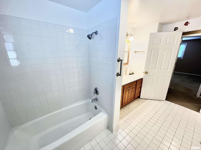 bathroom featuring vanity, tiled shower / bath combo, and tile patterned floors