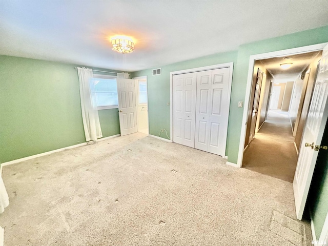 unfurnished bedroom featuring carpet flooring