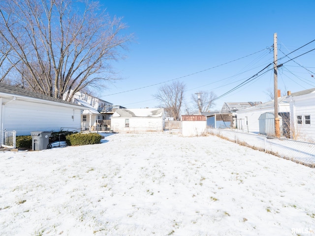 view of yard layered in snow