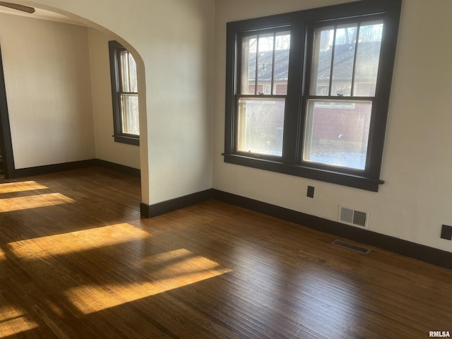 empty room featuring dark hardwood / wood-style floors