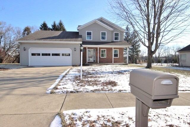 front of property with a garage