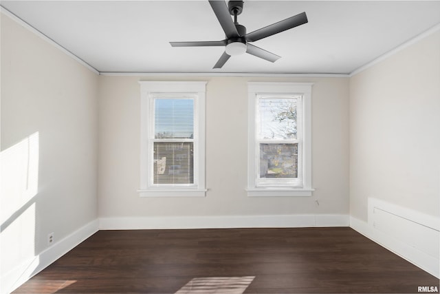 spare room featuring ceiling fan, dark hardwood / wood-style flooring, and ornamental molding