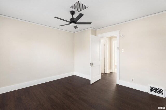 spare room featuring dark hardwood / wood-style floors, ceiling fan, and ornamental molding