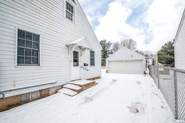 exterior space featuring an outbuilding and a garage