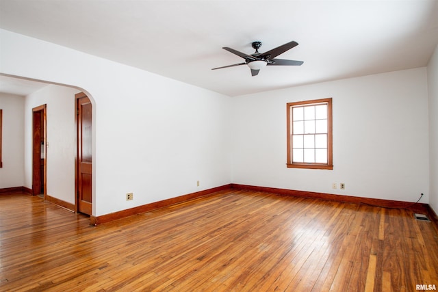 spare room featuring ceiling fan and hardwood / wood-style flooring