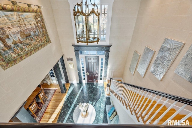 entryway featuring a towering ceiling