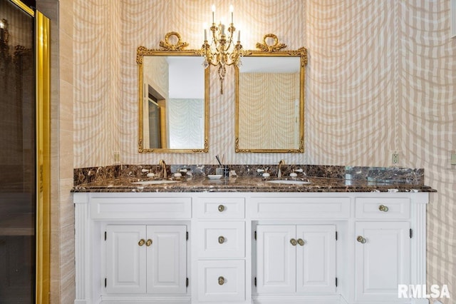 bathroom featuring vanity and an inviting chandelier