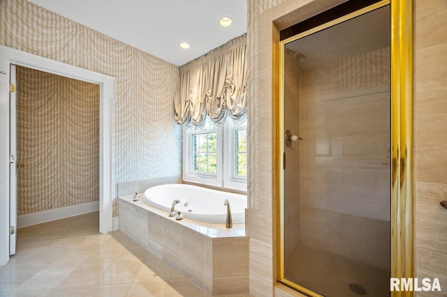 bathroom featuring tile patterned flooring, a chandelier, and independent shower and bath