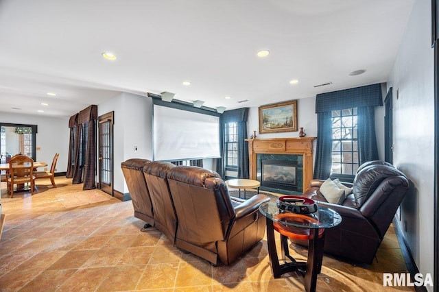 living room featuring a high end fireplace