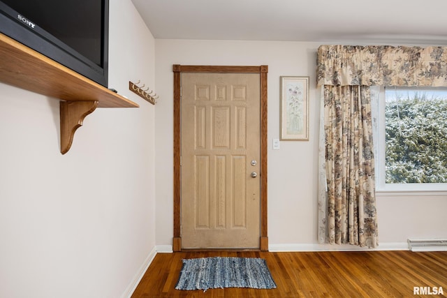 entryway with hardwood / wood-style flooring