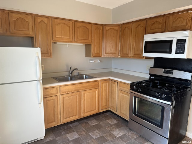 kitchen with white appliances and sink