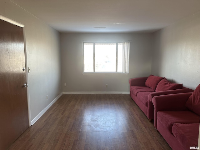 living room featuring dark hardwood / wood-style flooring