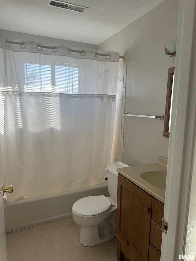 full bathroom featuring a textured ceiling, vanity, toilet, and tub / shower combination