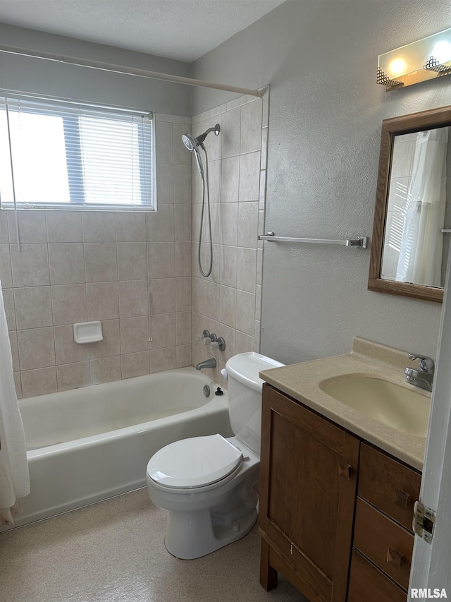 full bathroom with vanity, shower / bath combination with curtain, and toilet