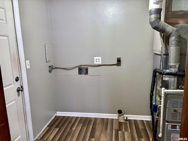 clothes washing area with electric dryer hookup, hookup for a washing machine, and dark hardwood / wood-style floors