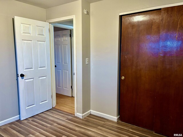 laundry room with electric panel, water heater, washer and clothes dryer, and light tile patterned flooring