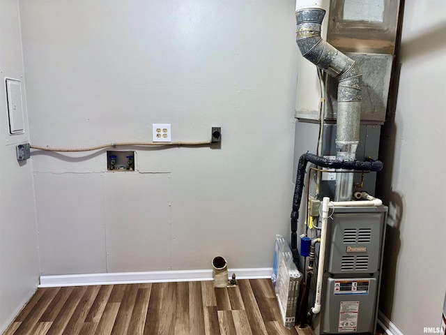 utility room with heating unit