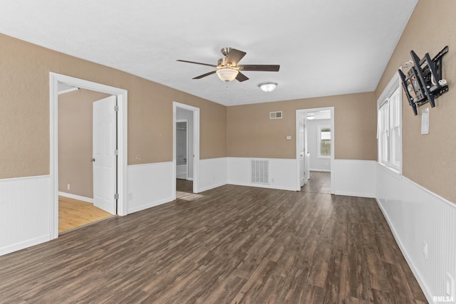 spare room featuring dark hardwood / wood-style floors and ceiling fan