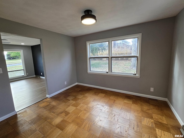 spare room with light parquet flooring