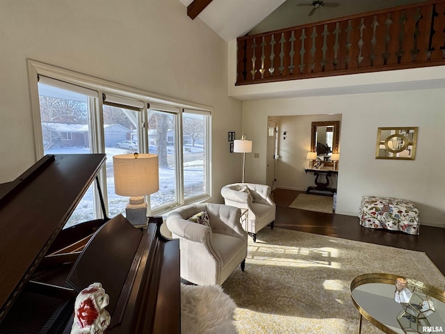 living room featuring hardwood / wood-style floors, ceiling fan, beamed ceiling, and high vaulted ceiling