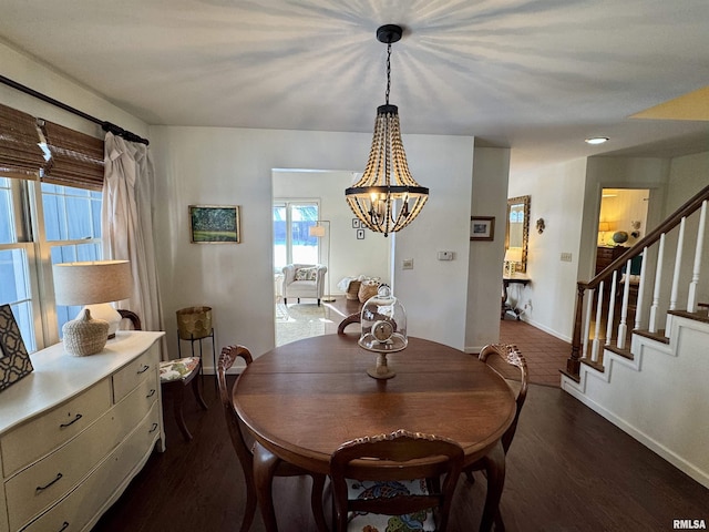 dining room featuring a chandelier and dark hardwood / wood-style floors