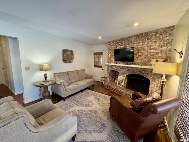 living room with a fireplace and hardwood / wood-style floors