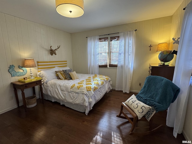 bedroom featuring dark hardwood / wood-style flooring