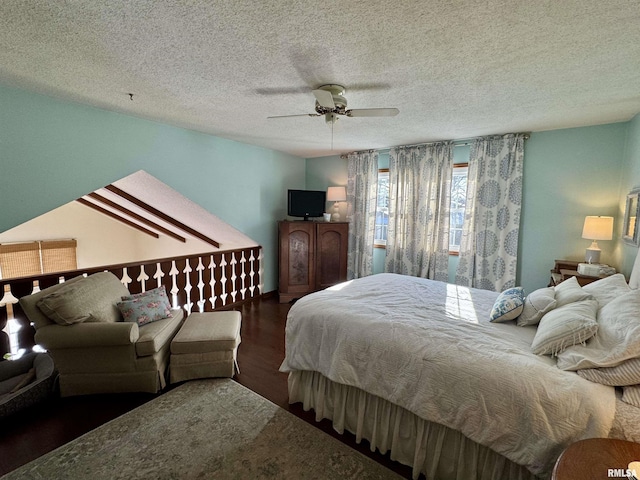 bedroom featuring ceiling fan, dark hardwood / wood-style floors, and a textured ceiling