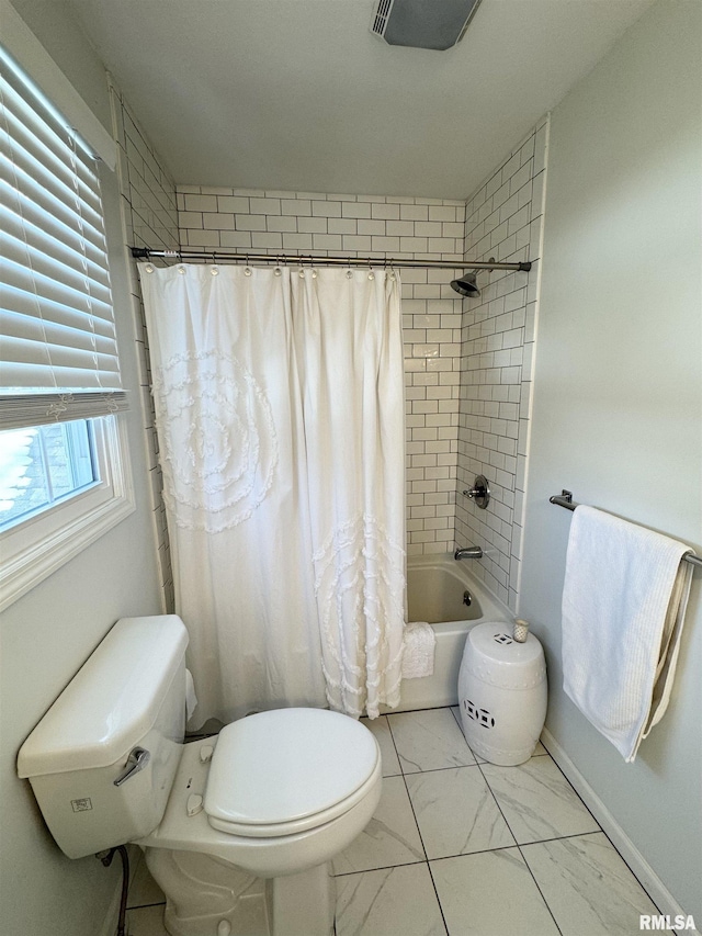 bathroom featuring toilet and shower / tub combo with curtain