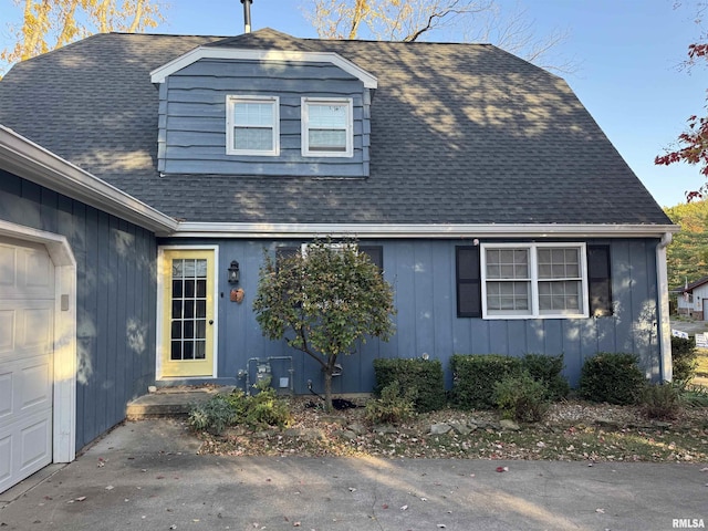 view of side of property featuring a garage