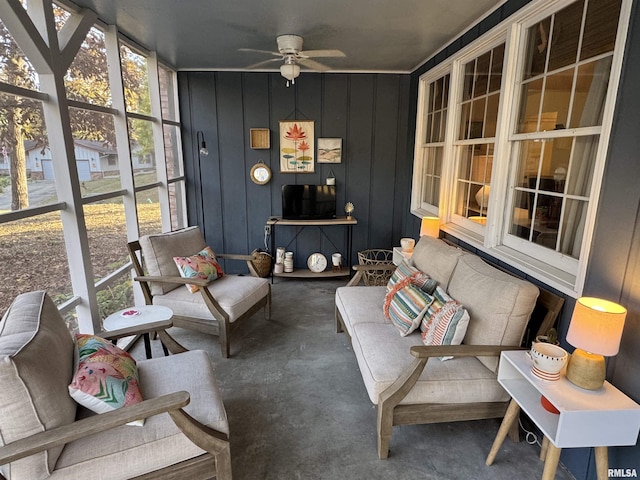 sunroom featuring ceiling fan