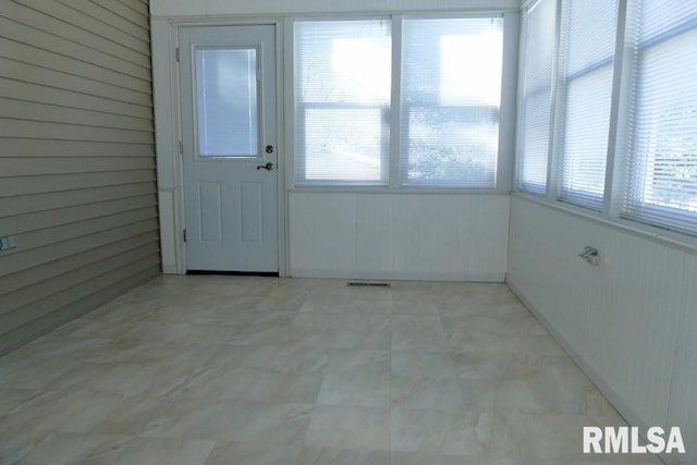 view of unfurnished sunroom