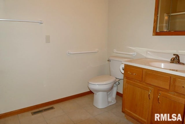 bathroom with vanity, toilet, and walk in shower