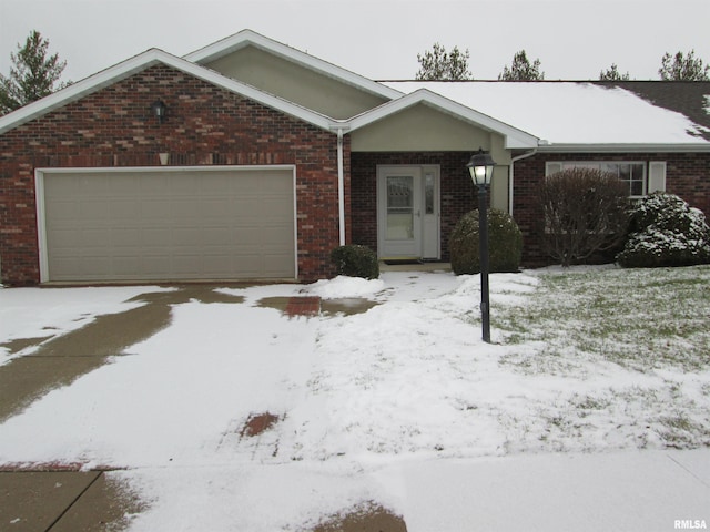 ranch-style house featuring a garage