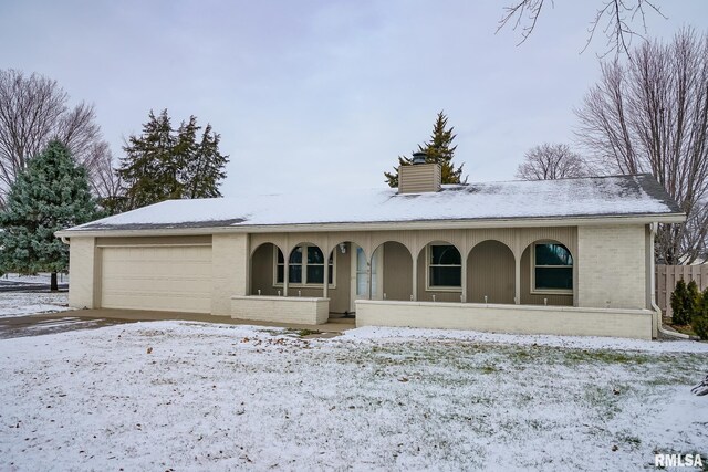 ranch-style house featuring a garage