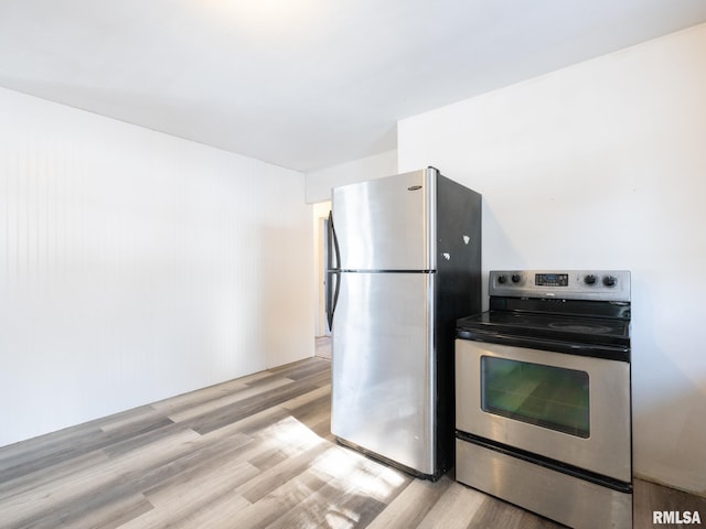 kitchen featuring light wood-type flooring and stainless steel appliances