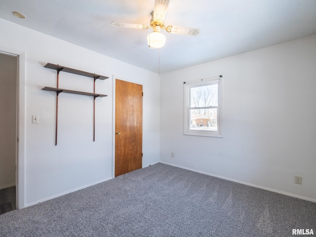 unfurnished bedroom with ceiling fan and carpet floors