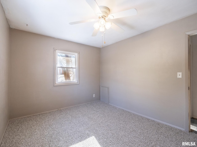 carpeted empty room with ceiling fan