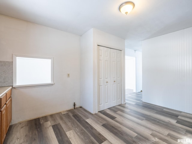 empty room with light hardwood / wood-style flooring