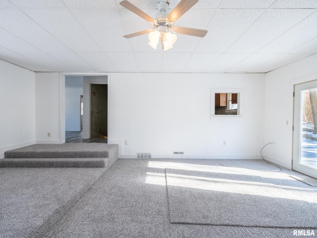 unfurnished room featuring carpet and ceiling fan