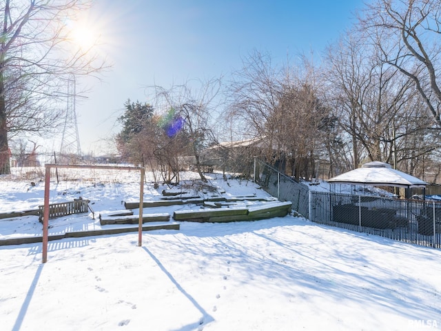 view of yard layered in snow