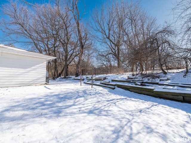 view of yard layered in snow