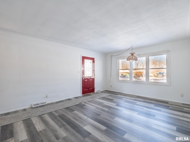 empty room featuring wood-type flooring