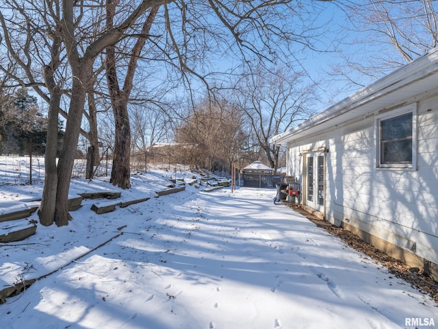 view of yard covered in snow