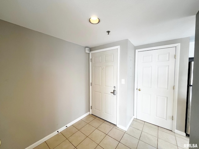 view of tiled foyer entrance