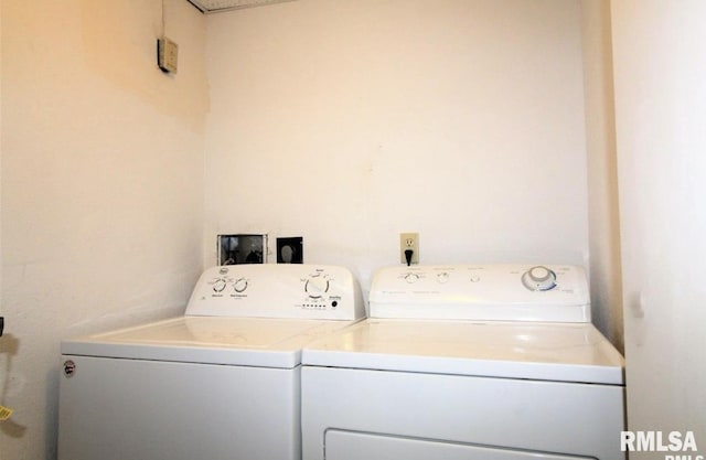 clothes washing area with independent washer and dryer