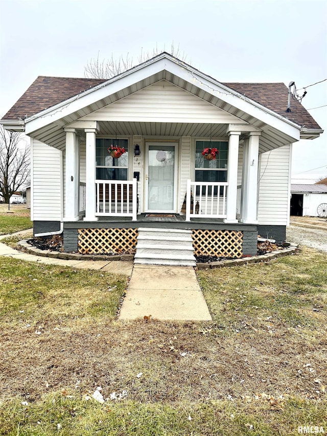 view of front of home featuring a porch and a front lawn