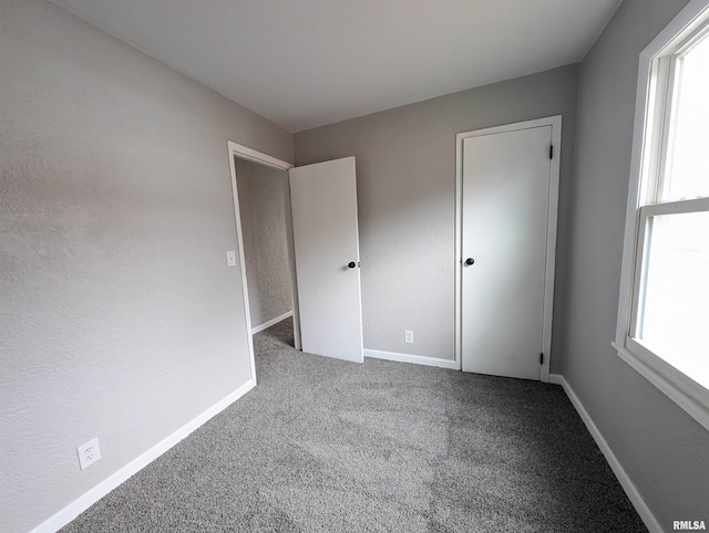 unfurnished bedroom featuring carpet floors