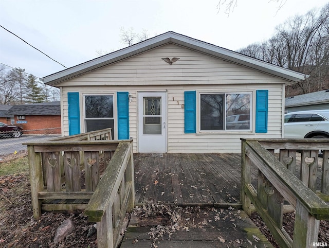 view of front of property with a wooden deck